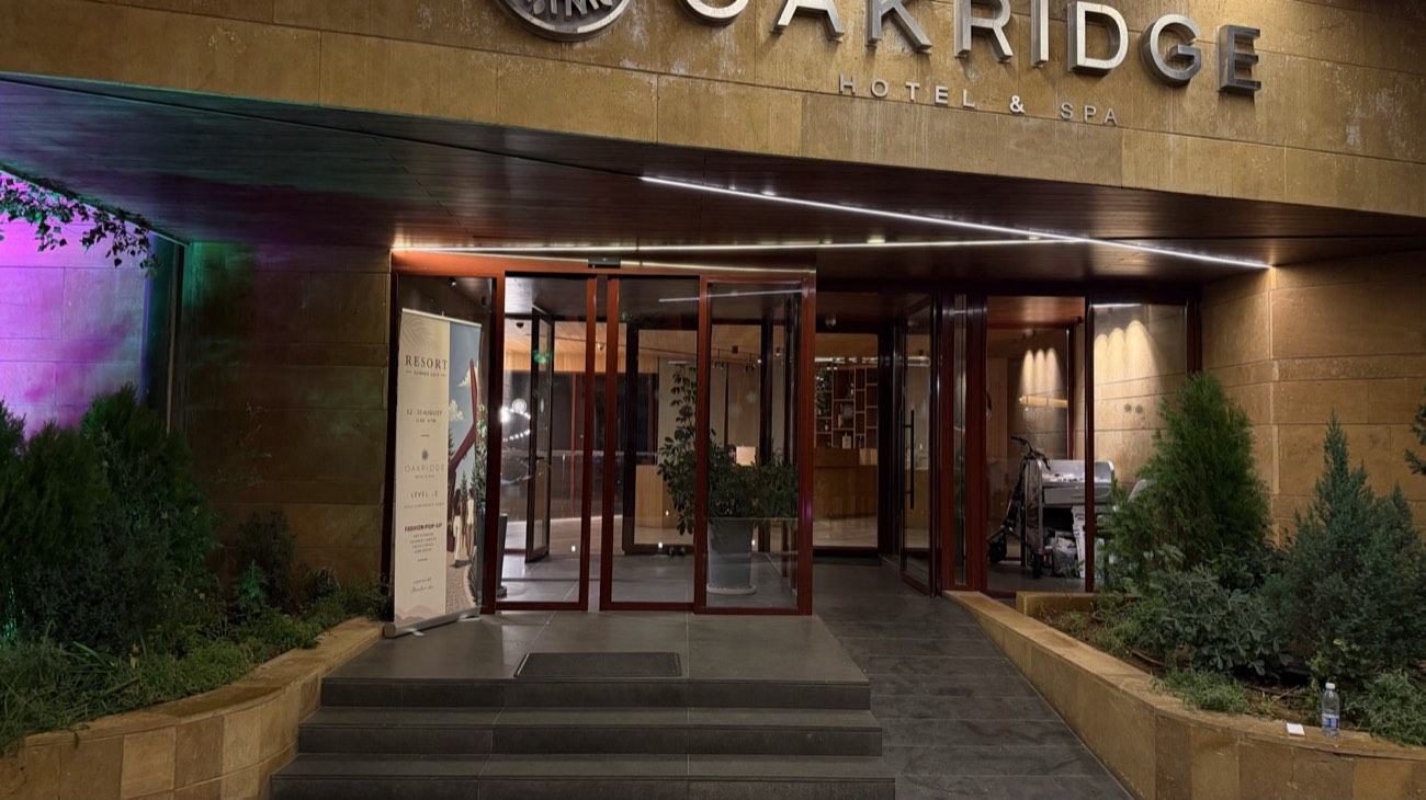 Entrance portal in framed glass at night
