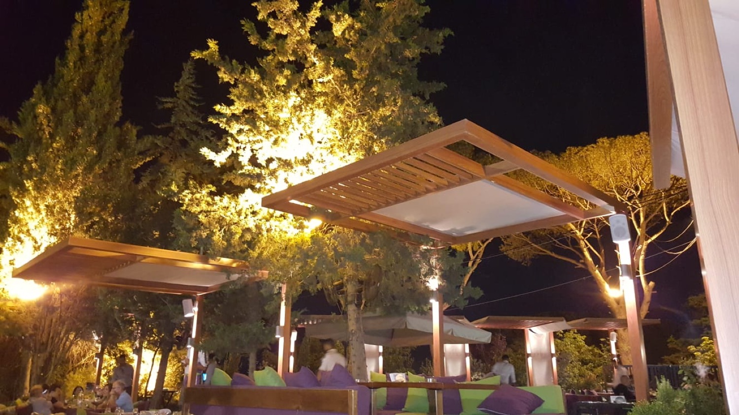 Timber canopies with tensioned fabric, over garden seating
